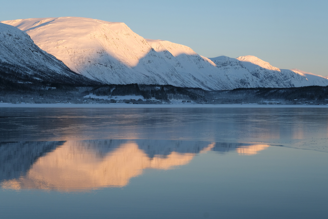 Adventurous fjord cruise offering breathtaking views of Tromsø's Arctic seascape and snow-dusted mountains