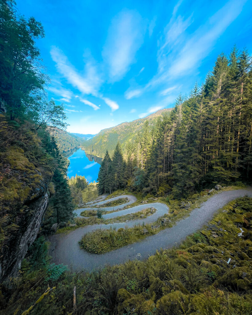 An aerial view of the winding Kossdalssvingane mountain road on Osterøy, offering breathtaking landscapes