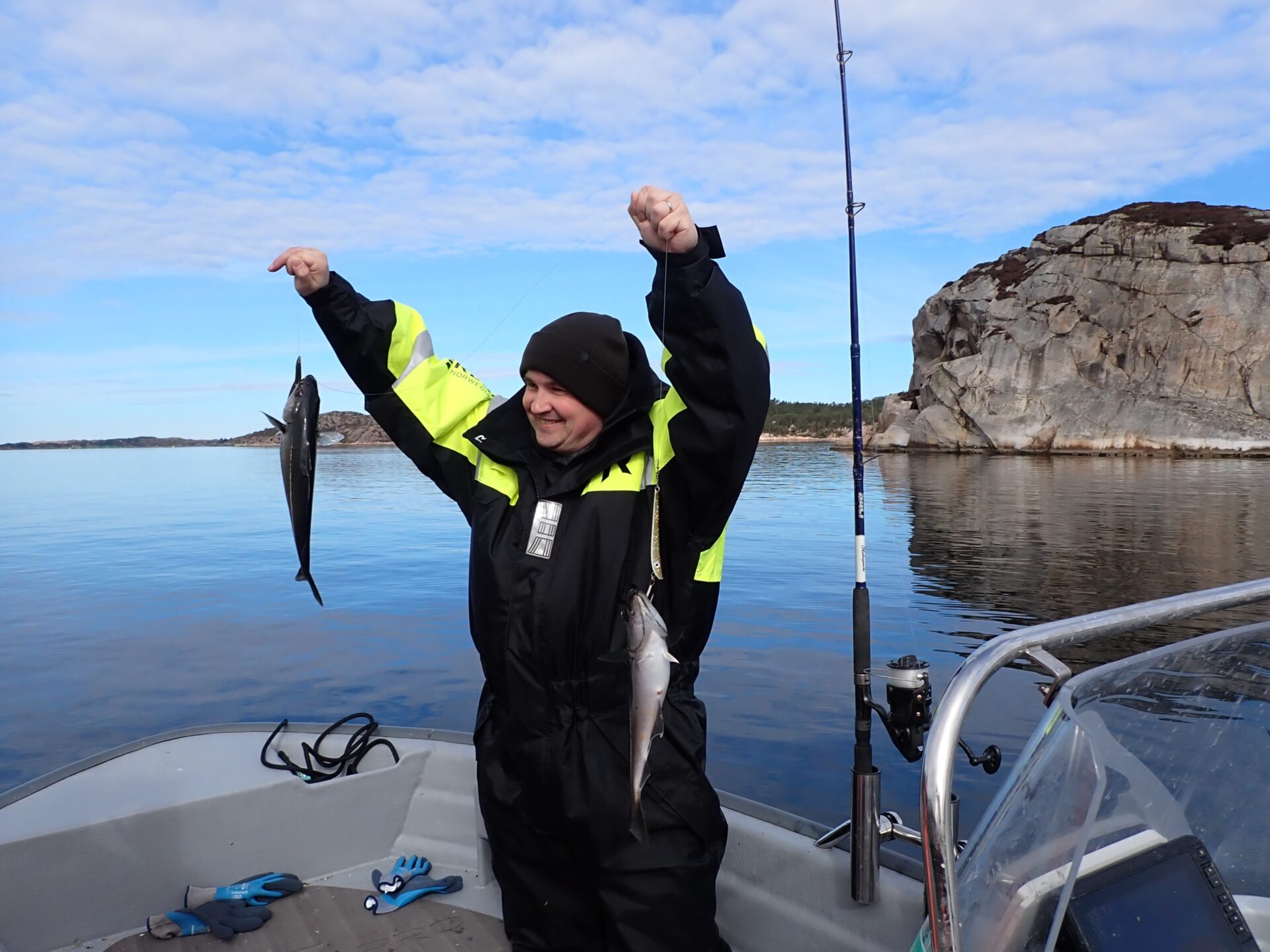 Happy guest proudly showing off a fish caught in Lysefjord